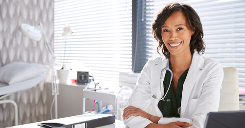 Dermatologist waiting for a patient in her office